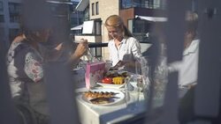 Family dinner on the balcony of the apartment Stock Footage