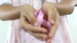 Girl with a pink ribbon. Cancer awareness concept. Stock Footage