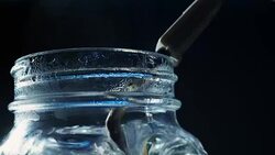 Boiling water with immersion heater Stock Footage