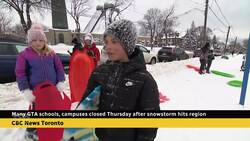 Toronto students head to toboggan hills after snow storm cancels classes News Clip