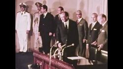 Man arrives at airport. Man speaks to press at conference. Plane on tarmac, 1972 Stock Footage