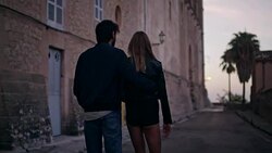 Happy couple on vacations. Old town panorama in background Stock Footage