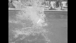 Male group called the Aqua-Nuts dive and belly flop into pool for entertainment act at Miami Beach's Nautilus Hotel News Clip