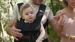 Parents Walking With Toddler In Forest Stock Footage