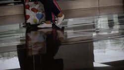 Airport . The feet of people pass with suitcases on wheels Stock Footage
