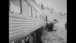California, 1952: After 2 days of plowing, a stuck train is finally able to move Stock Footage