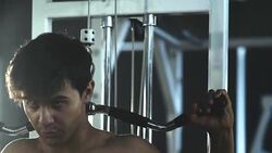 Young handsome man doing exercises in gym Stock Footage