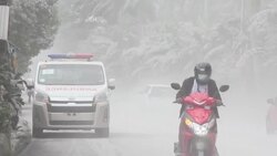 CLEAN : Residents clean up ash-covered houses after Philippines volcano erupts News Clip