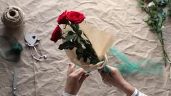 Woman is creating rose bouquet Stock Footage