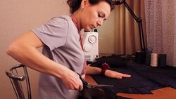 Dressmaker cuts out fabric. Stock Footage