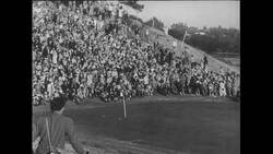 United States, 1950s: Panning shot of Ben Hogan hitting ball onto green Stock Footage