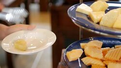 Woman hands selecting fruit from salad bar for Healthy food Stock Footage