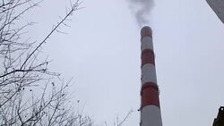 Smoking stack of the thermal power station against a gray sky. Smoking stacks of thermal power station. Stock Footage