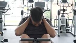 MS overweight Asian man doing sit-ups, front view Stock Footage