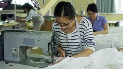 Asian Seamstresses Making Clothes at Factory Stock Footage