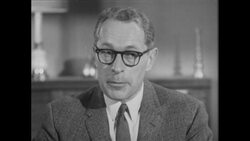 1960s: Man smiles and talks to family Stock Footage