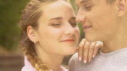 Teen couple looking at camera, concept of sexuality education for adolescents Stock Footage