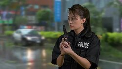 Asian American Woman Police Officer at Crime Scene Holding Gun and Looking Around Stock Footage