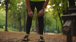 Man exercising / stretching in the park - nature. Stock Footage