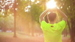 Man exercising / stretching in the park - nature. Stock Footage