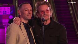U2's Bono and The Edge play pop-up gig in Kyiv metro station News Clip