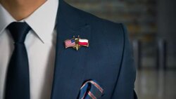 Businessman Walking Towards Camera With Friend Country Flags Pin United States of America - Poland.mov Stock Footage