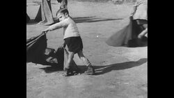 Boys and men practice matador moves; bull charges News Clip