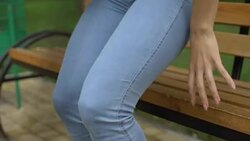 Woman feeling sharp knee pain while getting up from bench, painful inflammation Stock Footage