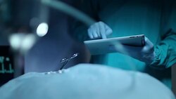 Medical diagnostics technology. Surgery hand use tablet computer Stock Footage