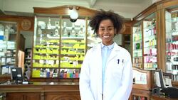 Portrait of young female chemist in pharmacy Stock Footage