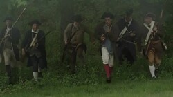 Colonial soldiers running out of woods firing muskets Stock Footage