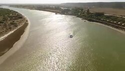 AERIAL boat on estuary/ Port Elizabeth/ South Africa Stock Footage