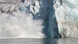 Powerful Glacier Calving in Svalbard with large splash and projectiles Stock Footage