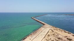 Drone Flight Over Ilha do Farol's Stunning Lighthouse & Shores Stock Footage