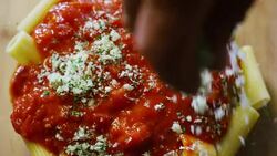 italian pasta with cheese and onion on the top, very old traditional and italian style, colored food and healthy and light food in italy, pasta bio and slow food. Stock Footage