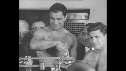 Rocky Marciano and Roland La Starza weigh-in prior to boxing match, 1953 News Clip