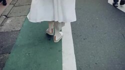 Female in shoes and skirt going in the city centre Stock Footage