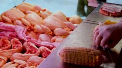 Hands of operators filling and forming sausages Stock Footage