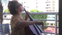 CLEAN : Panama: cellist holds concert from her balcony amid COVID-19 isolation News Clip
