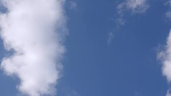 White fluffy clouds in the vast blue sky. Stock Footage