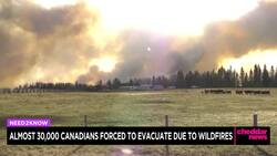 Out-of-control Wildfires Cause Evacuations in Western Canada News Clip