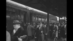 Probably new citizens board train returning to Portland in rain News Clip
