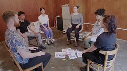 Serene creative business people meditating in circle in office Stock Footage