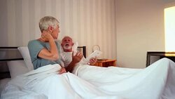 Senior woman complains of neck pain Stock Footage