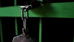 Slow Motion: Shackle hook stuck in the dark jail Stock Footage