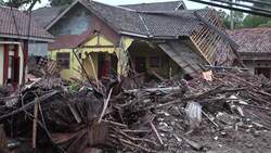 Wrecked homes, vehicles, in Carita; Serang driving shot News Clip