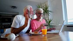Senior couple enjoying online shopping Stock Footage