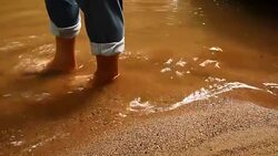 Man foot walking in the stream Stock Footage