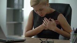 Female manager working on computer, suffering from sharp chest pain, arrhythmia Stock Footage