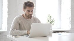 Creative man Typing On Laptop in Loft  Office Stock Footage